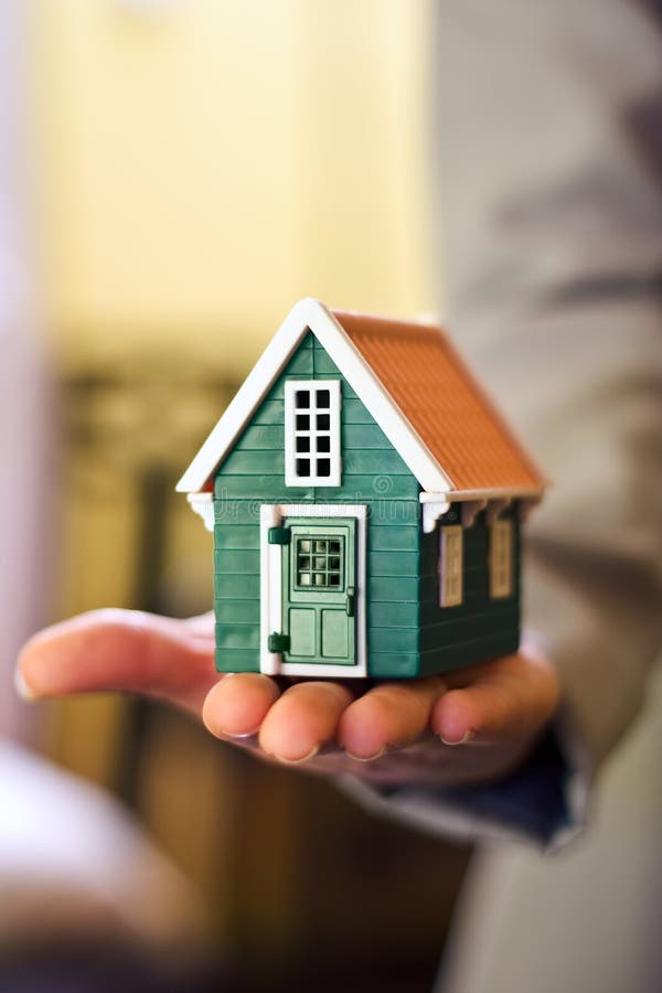 House in hand stock image. Image of metaphor, giving, holding 3933593