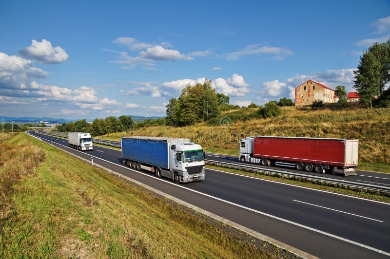 Two Trucks on the Road in the Countryside Stock Image - Image of brown ...