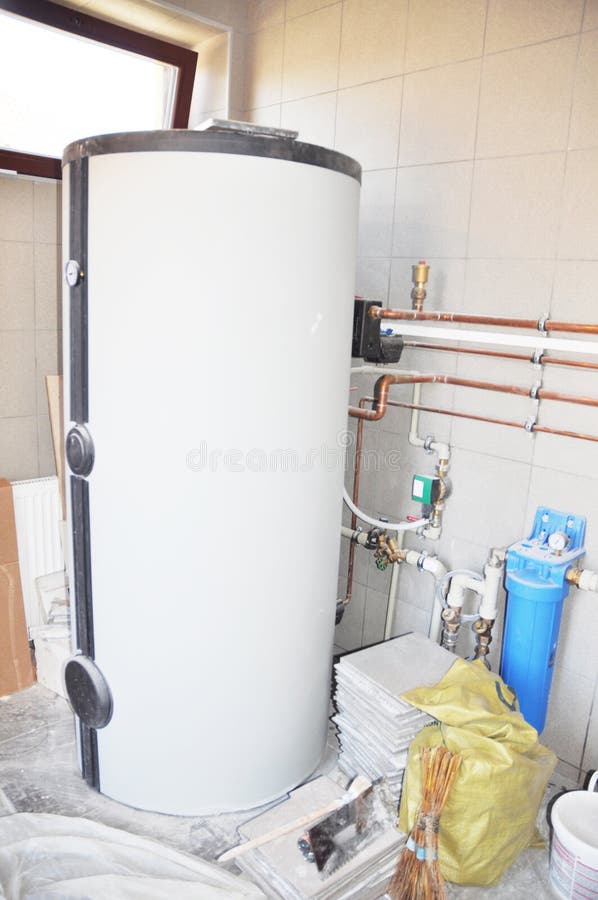 House hot water tank for house heating with copper pipeline, water filter, water pump in boiler room