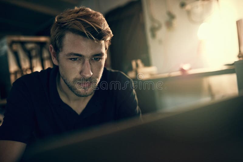 House, man and laptop with reading at night for freelance job, programming and online communication. Remote work, web royalty free stock photo