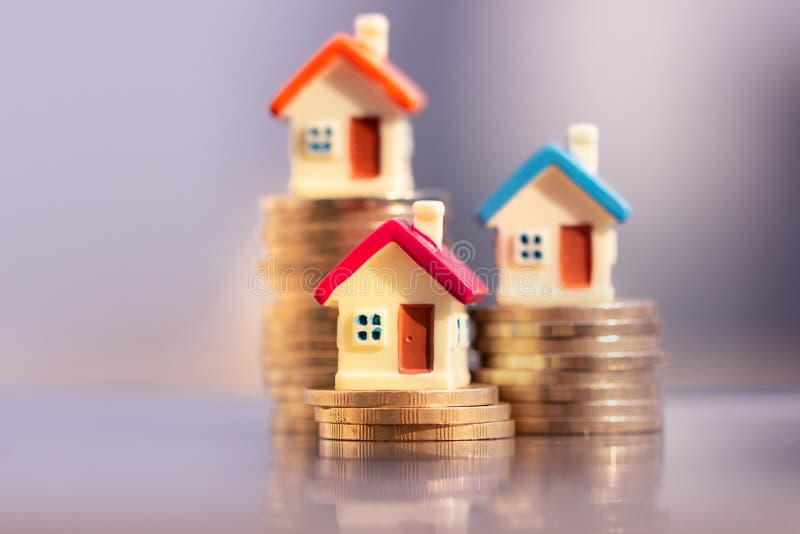House model on coins stack. planning savings money of coins to buy a home concept. royalty free stock image House model on coins stack. planning savings money of coins to buy a home concept. royalty free stock image