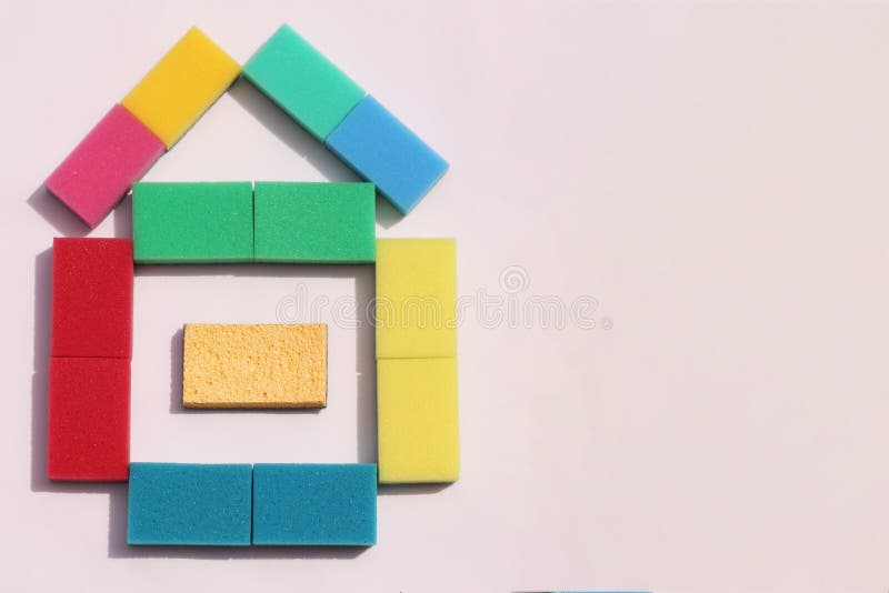 House of multi-colored sponges for cleaning dishes on a white background. The apartment was lying. Space for text. Multi colored foam sponges stock images, royalty-free photos and pictures