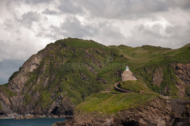 A house perched on a cliff above the sea royalty free stock image A house perched on a cliff above the sea royalty free stock image