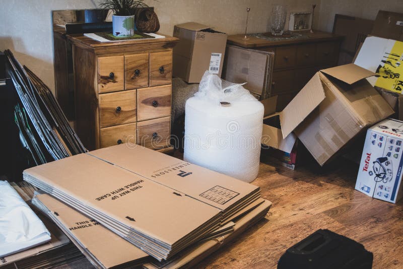 A house during the process of moving, with items packaged up for movers or removals to take.