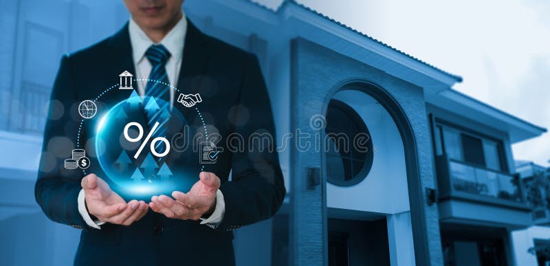 The house sign appears on the virtual screen as the businessman\'s hand is signed on paper. Planning, taxation, interest stock image