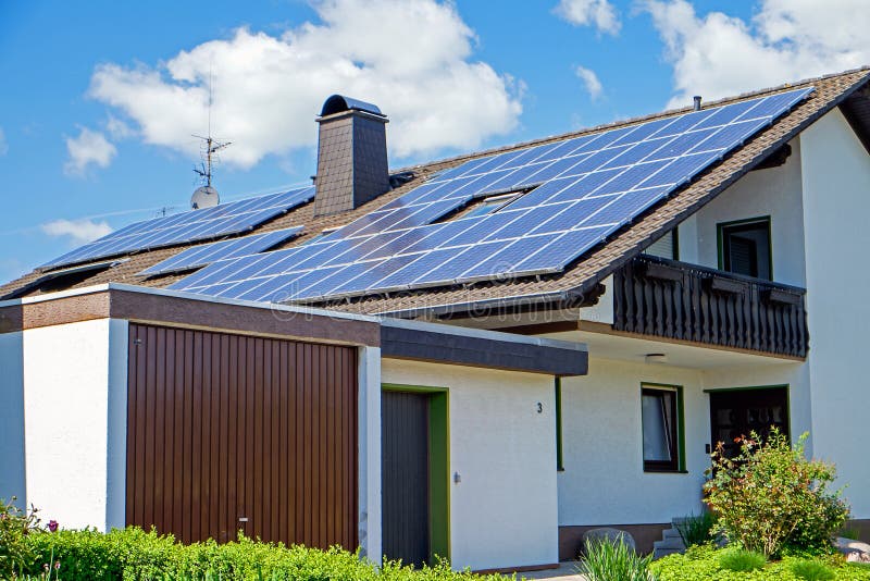 House with solar panels stock image