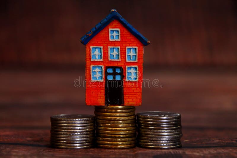 House with stack of coins. stock photo. Image of model 161132808