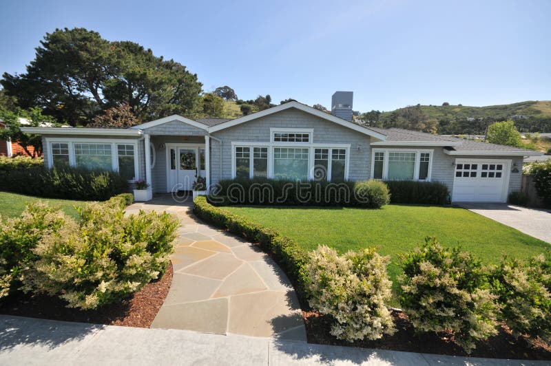 House with tile walkway to front door