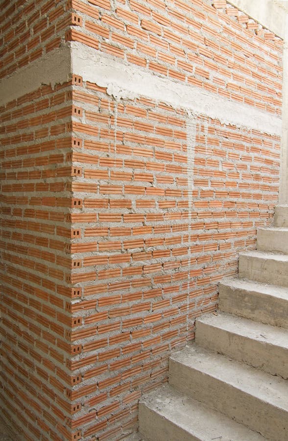 House under construction with red brick wall stock photo