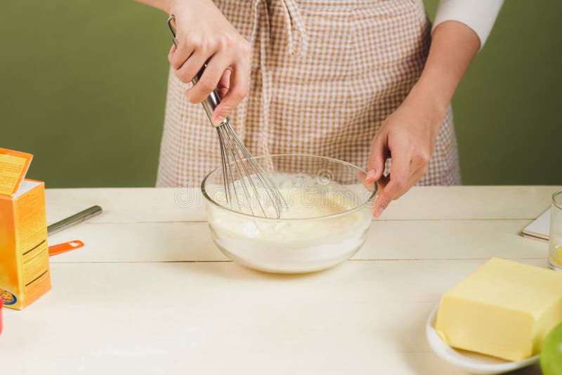 House wife wearing apron making. Steps of making cooking chocolate cake. Preparing dough, mixing ingredients royalty free stock photography House wife wearing apron making. Steps of making cooking chocolate cake. Preparing dough, mixing ingredients royalty free stock photography