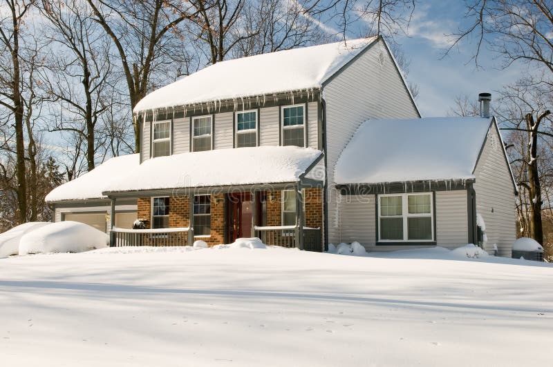 House after winter snowstorm royalty free stock photo
