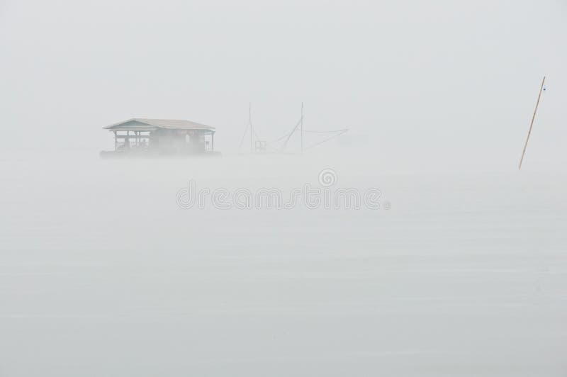 Houseboat in the mist