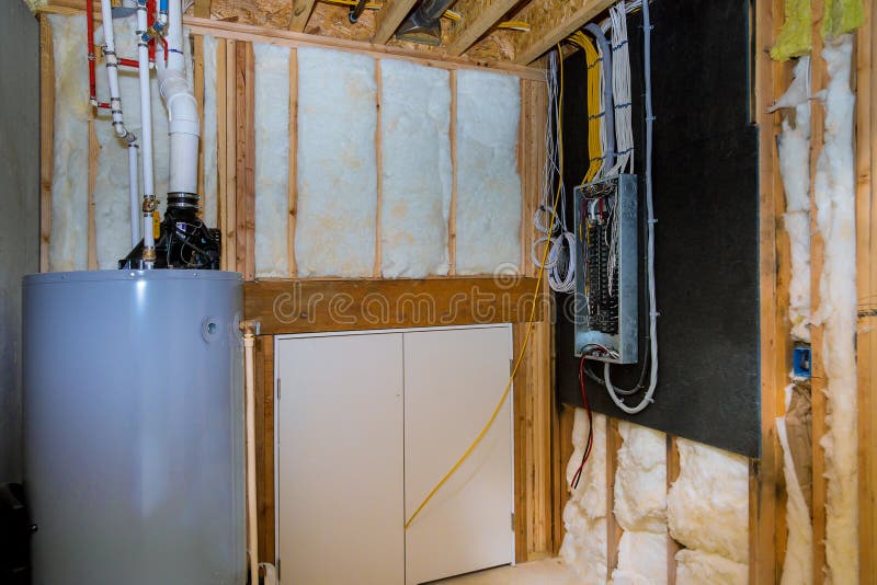 Household boiler house with heat wired electrical terminals on metal bar wall insulation in wooden house, building under stock photography Household boiler house with heat wired electrical terminals on metal bar wall insulation in wooden house, building under stock photography