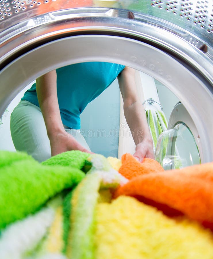 Householder Loading Clothing into Washing Machine Stock Image Image