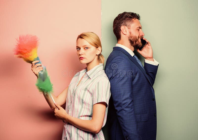 Housekeeping routine. Couple man and woman team. Housekeeping or business. Housewife and businessman. Career and stock photos Housekeeping routine. Couple man and woman team. Housekeeping or business. Housewife and businessman. Career and stock photos