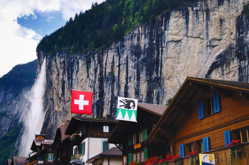 Houses in Lauterbrunnen (Switzerland) and Staubbach Falls