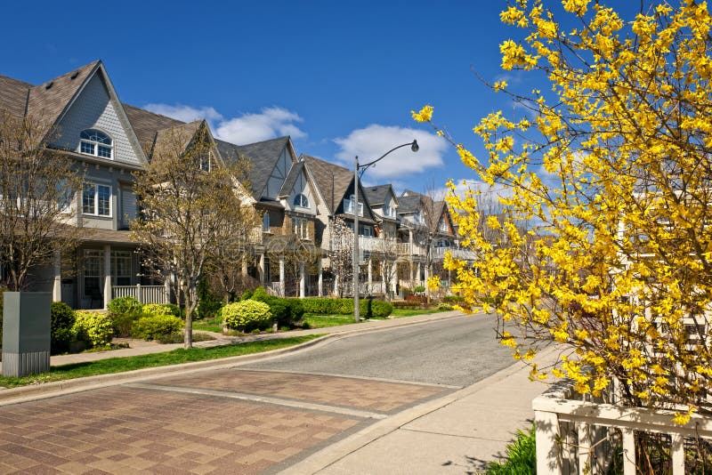 Houses on residential street in spring stock images Houses on residential street in spring stock images