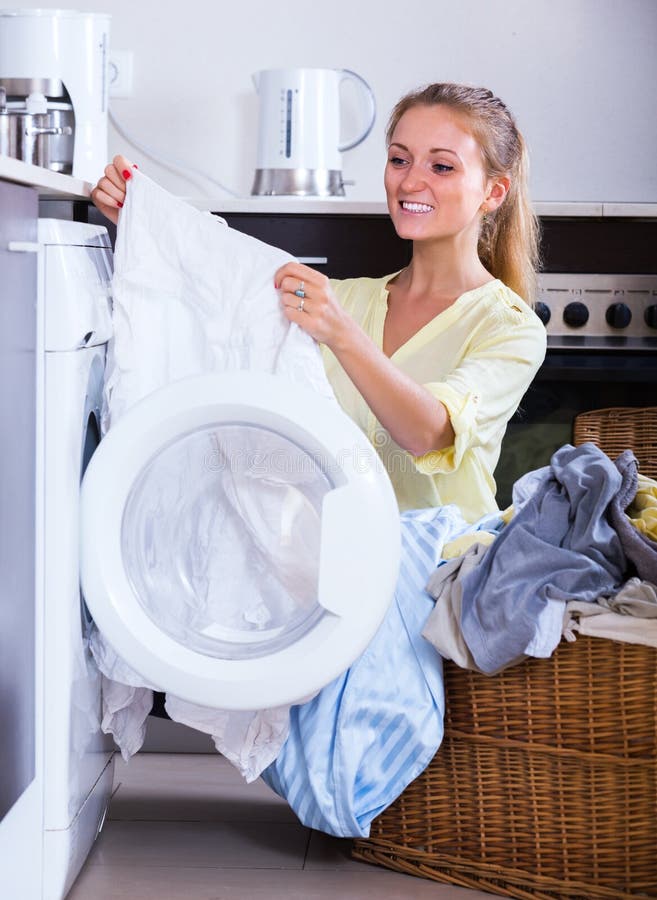 Housewife Taking Clothes Out Machine Stock Photo - Image of flat ...