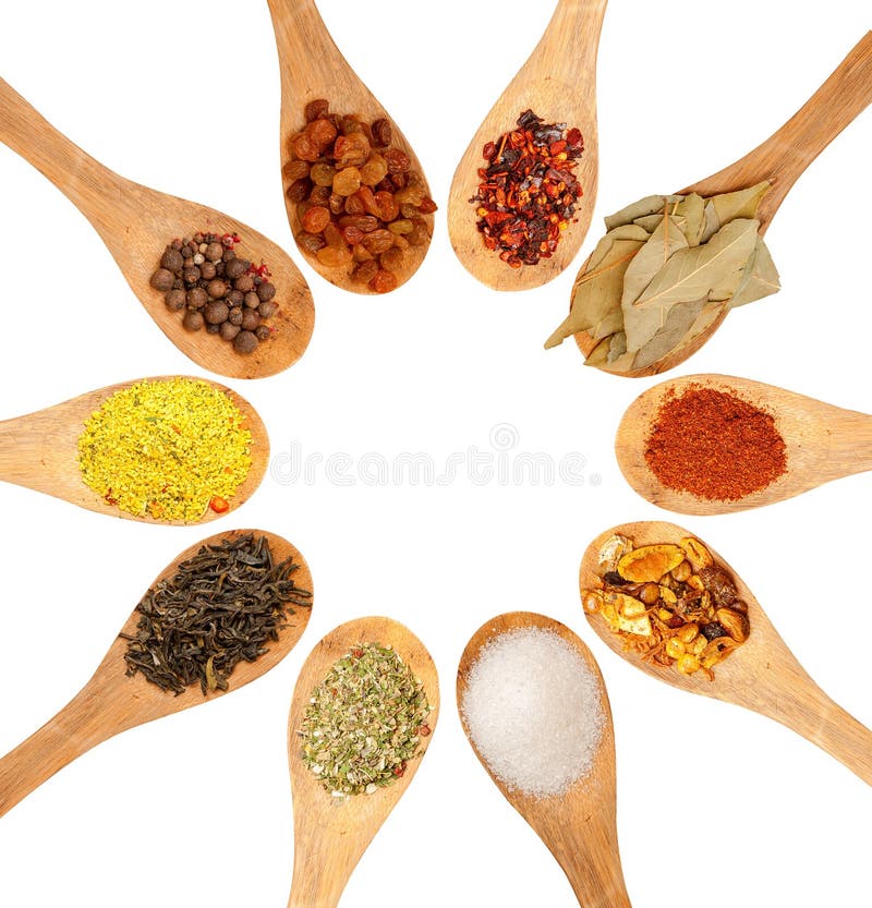 Wooden spoons with seasonings on a white background, each one is shot separately. Wooden spoons with seasonings on a white background, each one is shot separately