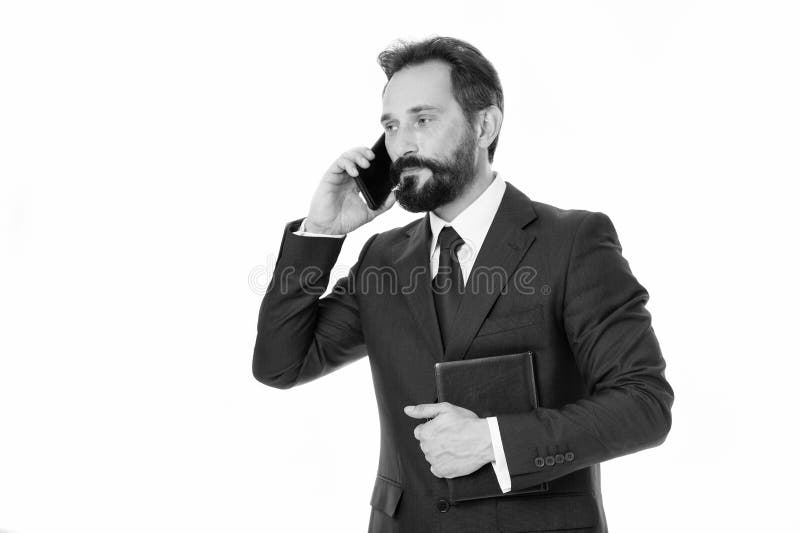 How can i help you. Businessman calling client hold notepad. Man bearded manager phone conversation smiling face royalty free stock photo How can i help you. Businessman calling client hold notepad. Man bearded manager phone conversation smiling face royalty free stock photo