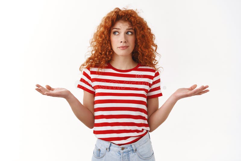 How should I know. Ignorant sassy redhead curly-haired good-looking woman shrugging perplexed look aside lying hands royalty free stock image How should I know. Ignorant sassy redhead curly-haired good-looking woman shrugging perplexed look aside lying hands royalty free stock image