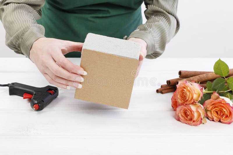 How To Make Floral Arrangement with Roses and Cinnamon Sticks Stock