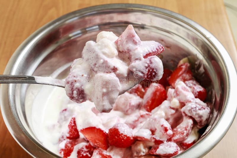 How to make ice cream dessert with fresh strawberries and bananas royalty free stock photography