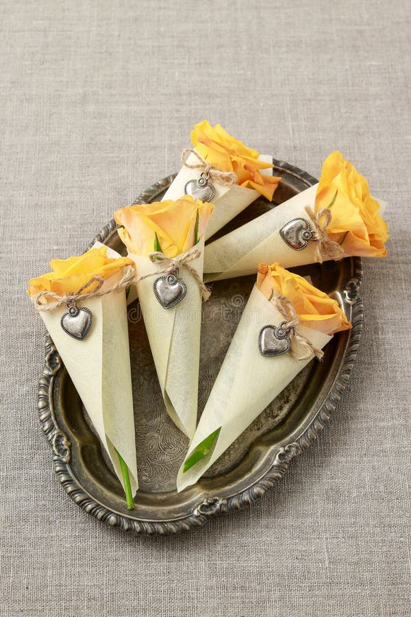 Florist at work: how to make lovely present for wedding guests with roses. Step by step, tutorial. Wedding cone stock images, royalty-free photos and pictures