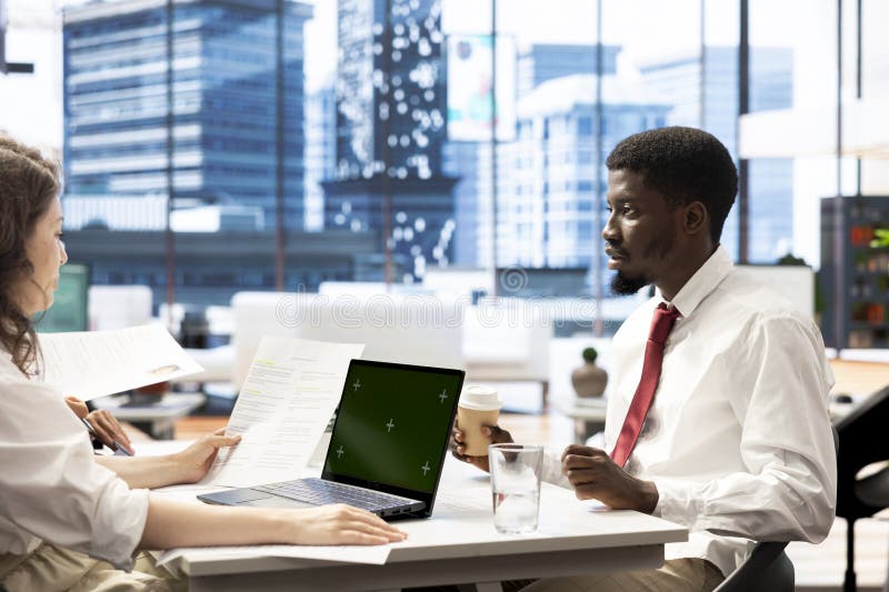 HR employee using mockup notebook to evaluate if CV qualifications match demands royalty free stock images