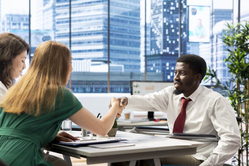 HR expert reviewing candidate with impairment, asking questions about qualifications stock image