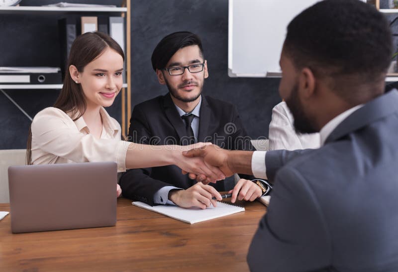 HR manager shaking hands with applicant at interview royalty free stock photos HR manager shaking hands with applicant at interview royalty free stock photos