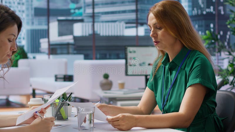 HR staff consulting each other in choosing the right candidate for the job opening stock photo