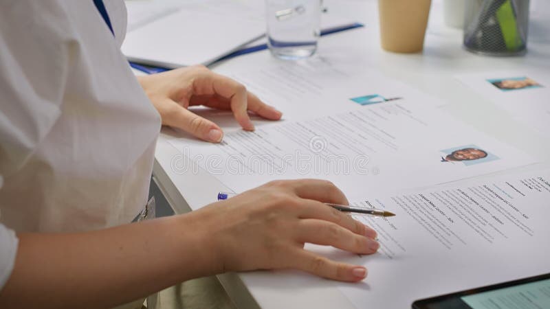 HR staff going through the selection process phase of the recruitment activity stock photo