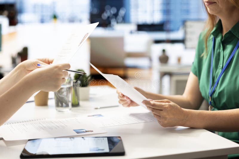 HR staff member reviewing candidate, asking questions about qualifications stock photography