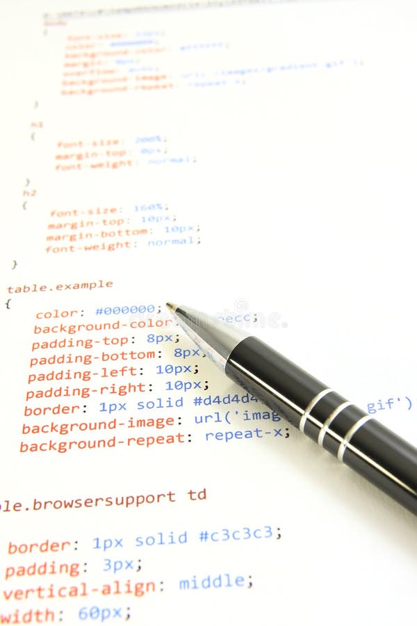 A sheet of paper with html source code and pen lying on it. A sheet of paper with html source code and pen lying on it