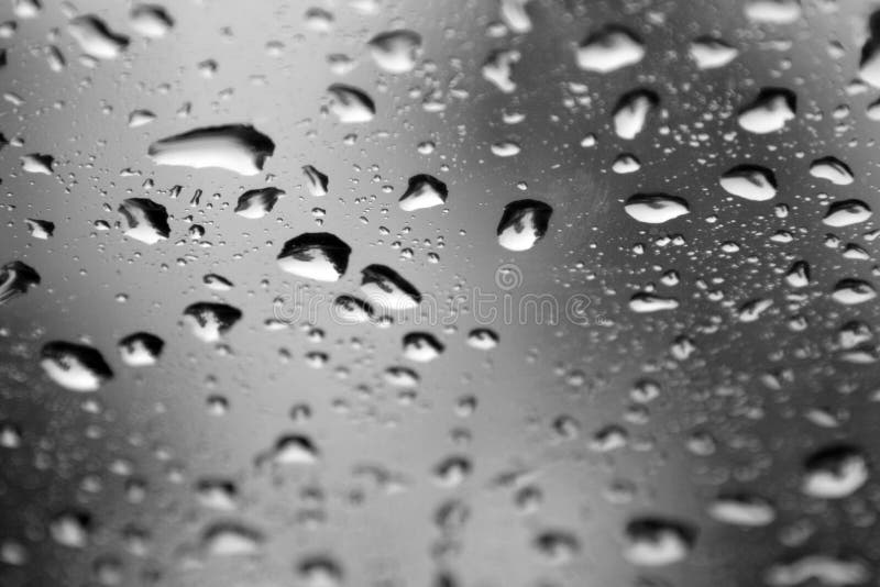 Water Drops On A Window - Abstract Background - Desaturated. Water Drops On A Window - Abstract Background - Desaturated