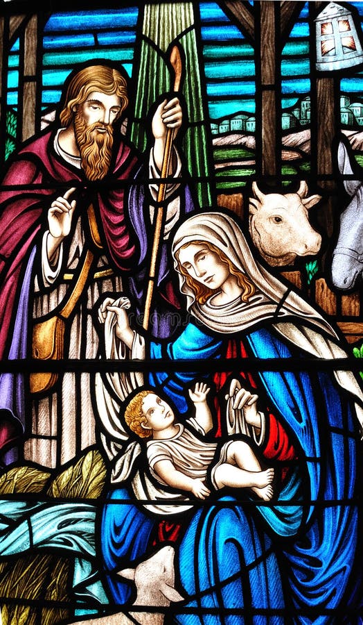 The birth of the Jesus depicted on the stained glass window. The birth of the Jesus depicted on the stained glass window