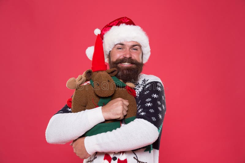 Hug is mood enhancer. Happy santa embrace reindeer toy. Bearded man in cool mood. Awesome holiday mood. Christmas mood royalty free stock photos