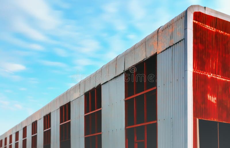 Huge Abandoned Metal Hangar Against a Blue Sky stock photos Huge Abandoned Metal Hangar Against a Blue Sky stock photos