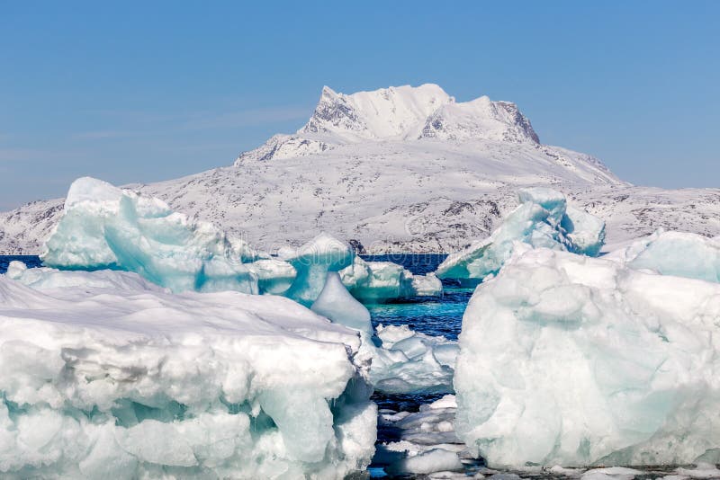 Huge blue icebergs drifting and laying ashore, Greenland royalty free stock photo Huge blue icebergs drifting and laying ashore, Greenland royalty free stock photo