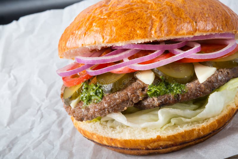 Huge burger on a wrapping paper