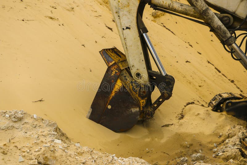 Huge Excavator Bucket Digs Sand in Sand Quarry Mining Stock Image