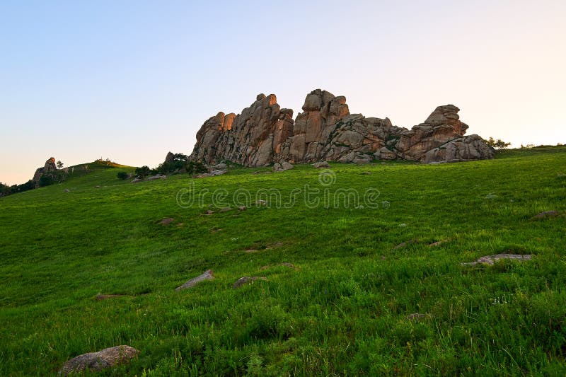 The huge granite on the alpine meadow sunset