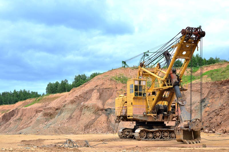 Huge mining excavator in the limestone open-pit. stock photos