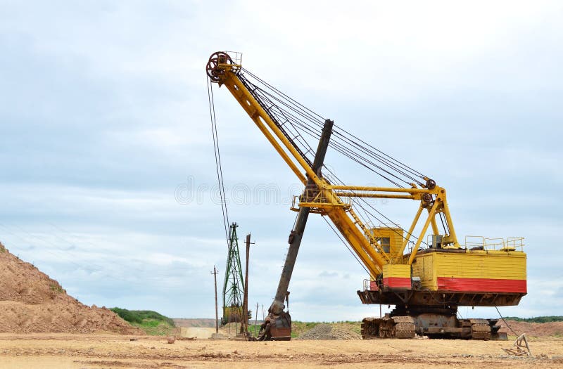 Huge mining excavator in the limestone open-pit. stock images