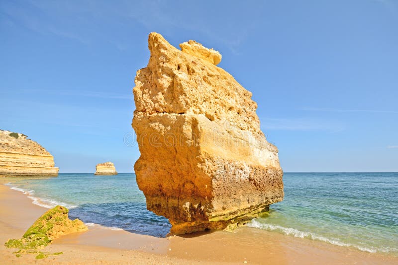 Huge rock at the cliff beach of Praia da Marinha, lovely hidden beach near Lagoa Algarve Portugal