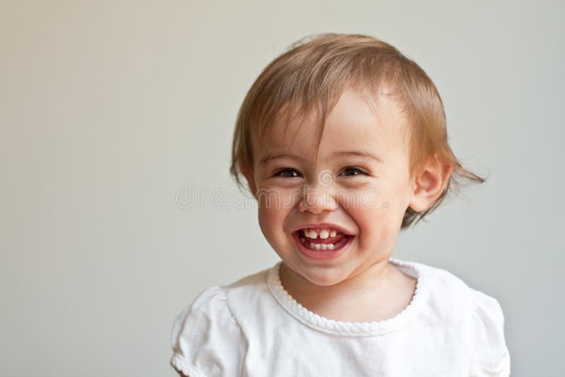 Huge smile on 1 year old's baby face stock photo Huge smile on 1 year old's baby face stock photo