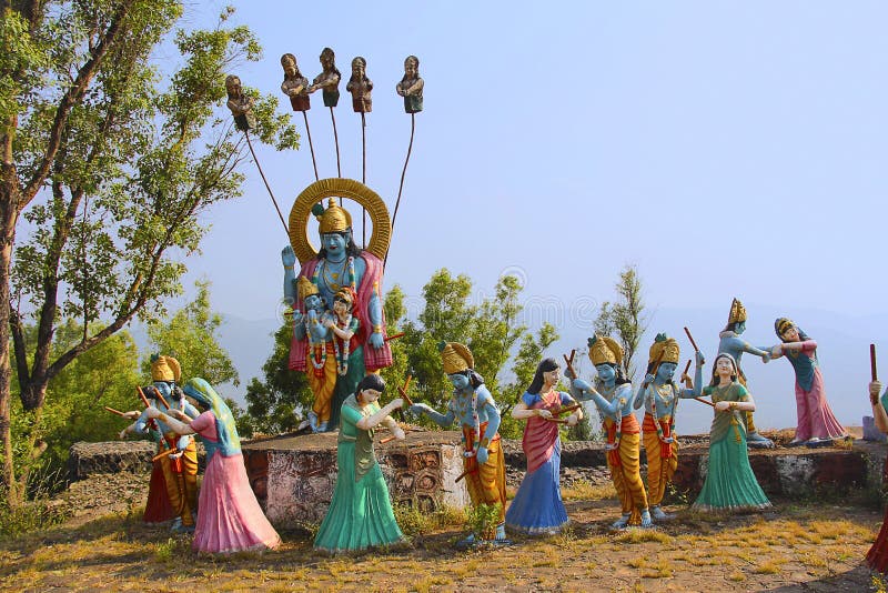 Huge statue of Lord Shri Krishna and Radha with Gopis performing raas leela, Nilkantheshwar Temple royalty free stock image