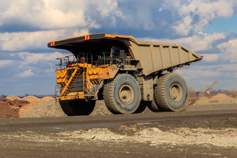 Huge Yellow Mining Dump Truck Working in Iron Ore Quarry. Mining ...