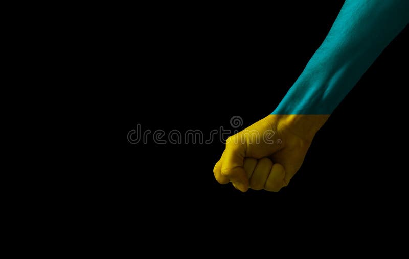 Human fist graphics on Ukraine flag background. Concept of resistance. Stop war between Russia and Ukraine. Creative